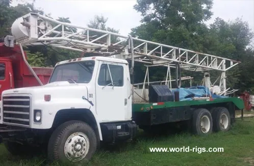 Failing 1250 Drill Rig & Water Truck for Sale